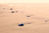 Photo Wallpaper Pebbles in the sand