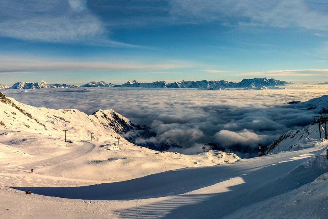 Photo Wallpaper Above the clouds in the snow