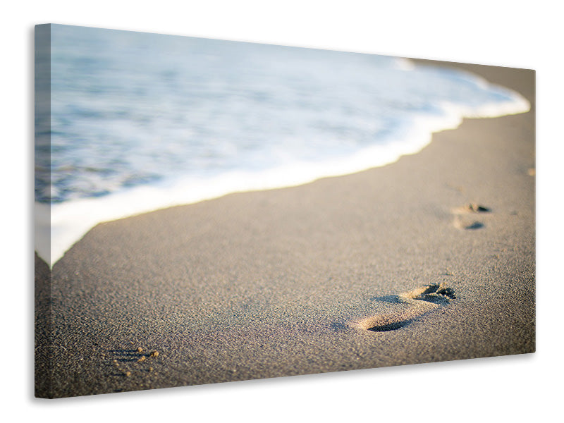 Canvas print Footprints in the sand on the beach