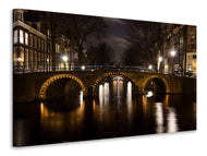 Canvas print At night in Amsterdam