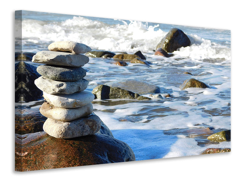 Canvas print Stone pile at the sea