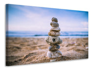 Canvas print Stone pile on the beach